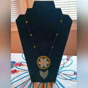 Beaded necklace with pouch